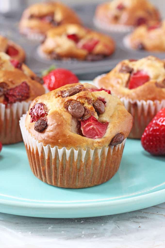 Healthy Strawberry & Chocolate Chip Muffins on a blue plate.